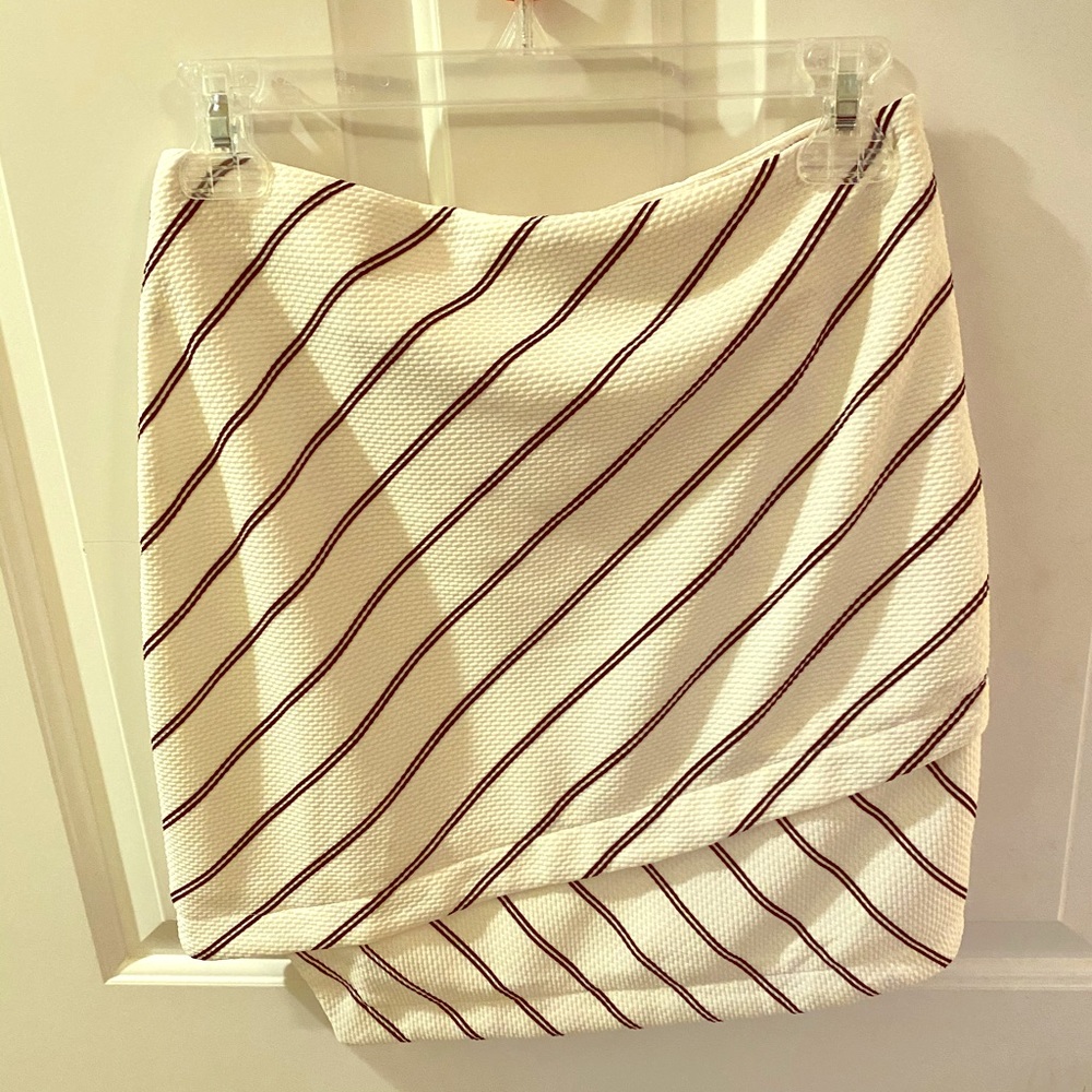 White and black asymmetrical wrap mini skirt